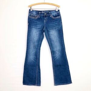 Red camel boot, cut jeans